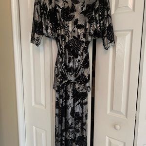 Elegant blk  and silver dress by Jasmine Sz small. With beautiful open back.